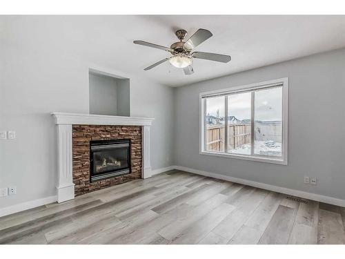 158 Saddlecrest Close Ne, Calgary, AB - Indoor Photo Showing Living Room With Fireplace