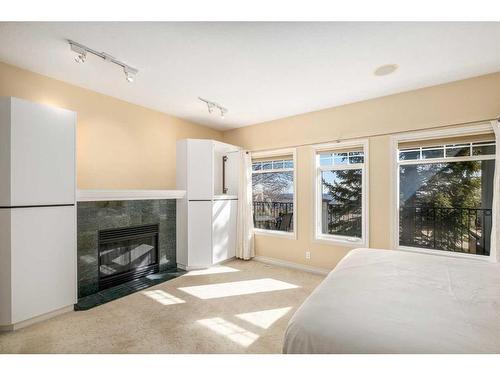 63 Prominence Point Sw, Calgary, AB - Indoor With Fireplace