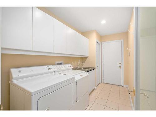 63 Prominence Point Sw, Calgary, AB - Indoor Photo Showing Laundry Room