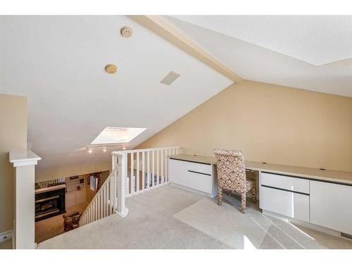 63 Prominence Point Sw, Calgary, AB - Indoor With Fireplace