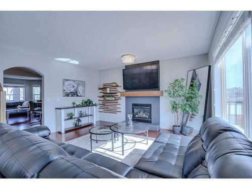 158 West Creek Springs, Chestermere, AB - Indoor Photo Showing Living Room With Fireplace