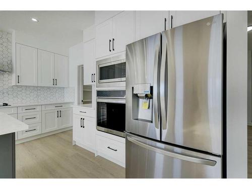 1372 Lackner Boulevard, Carstairs, AB - Indoor Photo Showing Kitchen With Stainless Steel Kitchen With Upgraded Kitchen