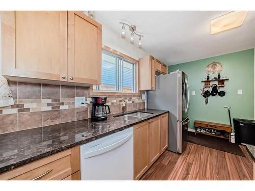 7611 Farrell Road Se, Calgary, AB - Indoor Photo Showing Kitchen With Double Sink