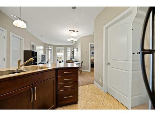 112-15304 Bannister Road Se, Calgary, AB - Indoor Photo Showing Kitchen With Double Sink