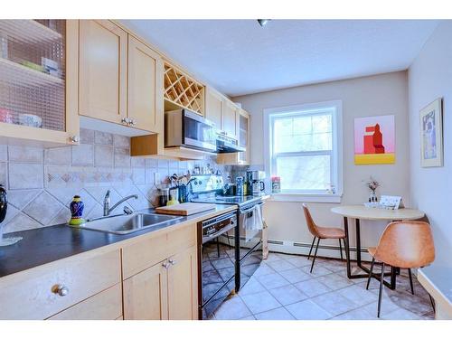 12-1125 17 Avenue Sw, Calgary, AB - Indoor Photo Showing Kitchen With Double Sink