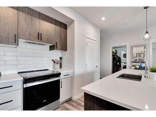 409-138 Sage Valley Common Nw, Calgary, AB - Indoor Photo Showing Kitchen With Upgraded Kitchen