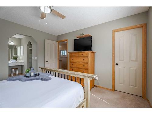 731 Coopers Drive Sw, Airdrie, AB - Indoor Photo Showing Bedroom
