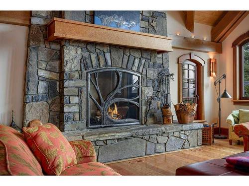 145 Silvertip Ridge, Canmore, AB - Indoor Photo Showing Living Room With Fireplace