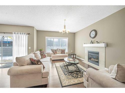 433 Mahogany Court Se, Calgary, AB - Indoor Photo Showing Living Room With Fireplace