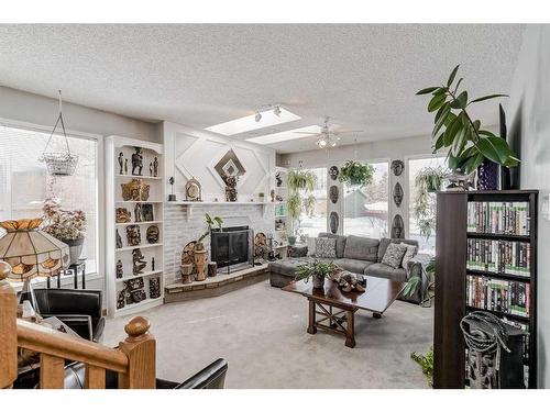 1968 Cottonwood Crescent Se, Calgary, AB - Indoor Photo Showing Living Room With Fireplace