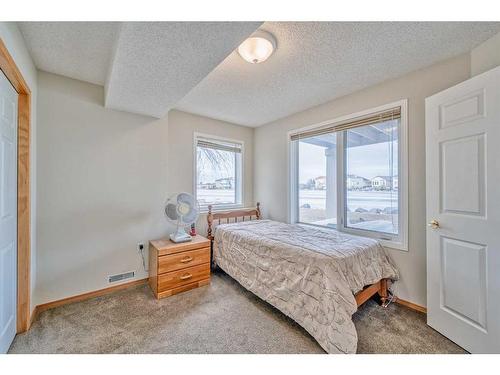 128 Coral Shores Cape Ne, Calgary, AB - Indoor Photo Showing Bedroom
