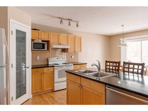 168 Wentworth Close Sw, Calgary, AB - Indoor Photo Showing Kitchen With Double Sink