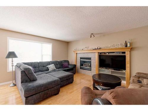 168 Wentworth Close Sw, Calgary, AB - Indoor Photo Showing Living Room With Fireplace