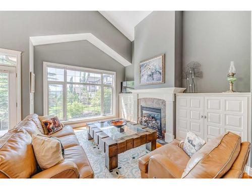 257 Discovery Ridge Way Sw, Calgary, AB - Indoor Photo Showing Living Room With Fireplace