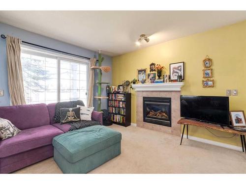2-2318 17 Street Se, Calgary, AB - Indoor Photo Showing Living Room With Fireplace
