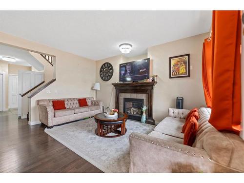 28 Saddlebrook Landing Ne, Calgary, AB - Indoor Photo Showing Living Room With Fireplace