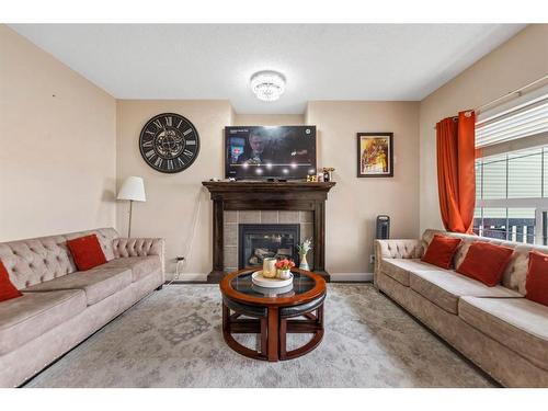 28 Saddlebrook Landing Ne, Calgary, AB - Indoor Photo Showing Living Room With Fireplace