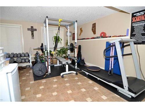 1239 Hunterquay Hill Nw, Calgary, AB - Indoor Photo Showing Gym Room