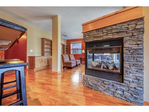 310-107 Armstrong Place, Canmore, AB - Indoor Photo Showing Living Room With Fireplace