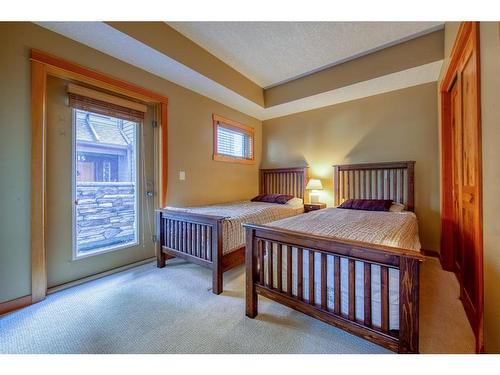 310-107 Armstrong Place, Canmore, AB - Indoor Photo Showing Bedroom