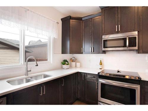 8 Walgrove Green Se, Calgary, AB - Indoor Photo Showing Kitchen With Double Sink With Upgraded Kitchen