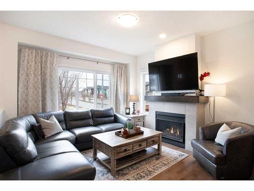 8 Walgrove Green Se, Calgary, AB - Indoor Photo Showing Living Room With Fireplace