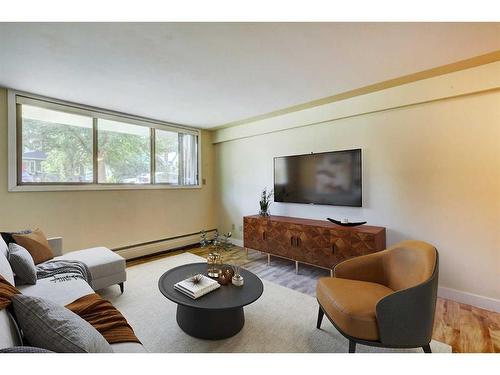 104-824 4 Avenue Nw, Calgary, AB - Indoor Photo Showing Living Room