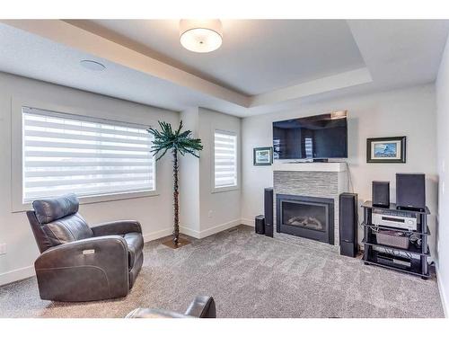 1408 Price Road, Carstairs, AB - Indoor Photo Showing Living Room With Fireplace
