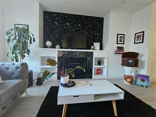 8136 Bowness Road Nw, Calgary, AB - Indoor With Fireplace
