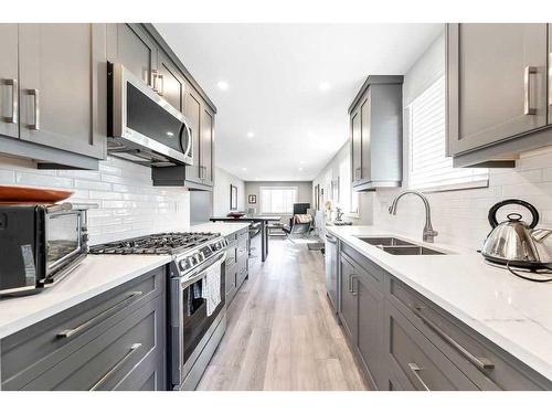 8019 20A Street Se, Calgary, AB - Indoor Photo Showing Kitchen With Double Sink With Upgraded Kitchen