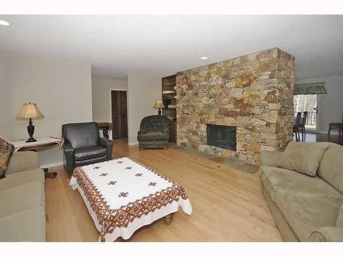 2758 85 Street Sw, Calgary, AB - Indoor Photo Showing Living Room With Fireplace