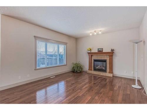 5 Sherwood View Nw, Calgary, AB - Indoor Photo Showing Living Room With Fireplace
