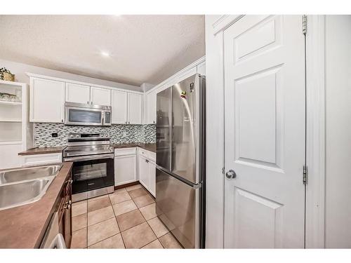 206 Saddlemont Boulevard Ne, Calgary, AB - Indoor Photo Showing Kitchen With Double Sink