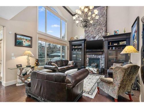 145 Aspen Glen Place Sw, Calgary, AB - Indoor Photo Showing Living Room With Fireplace