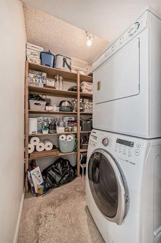 306-145 Point Drive Nw, Calgary, AB - Indoor Photo Showing Laundry Room