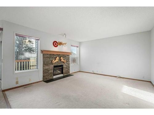 30 Somercrest Close Sw, Calgary, AB - Indoor Photo Showing Living Room With Fireplace