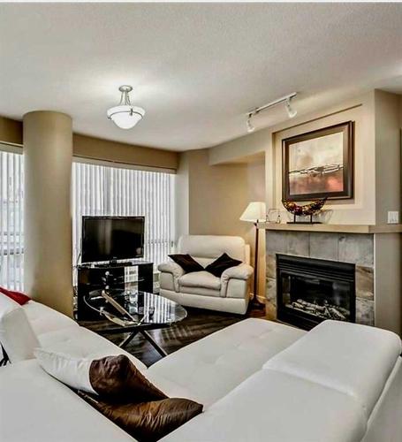502-1088 6 Avenue Sw, Calgary, AB - Indoor Photo Showing Living Room With Fireplace