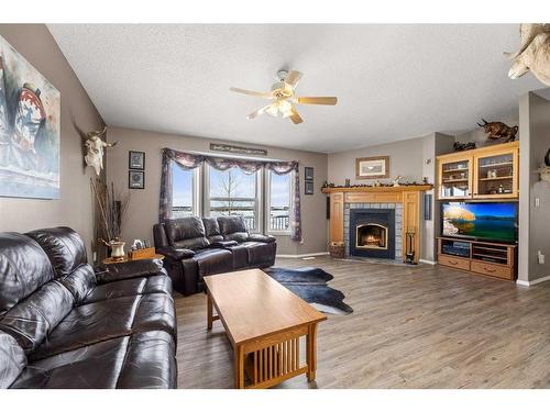 34048 Highway 2 Service Road Sb, Rural Red Deer County, AB - Indoor Photo Showing Living Room With Fireplace