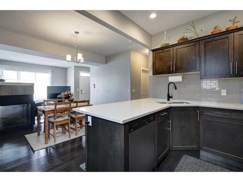 1-405 33 Avenue Ne, Calgary, AB - Indoor Photo Showing Kitchen With Fireplace