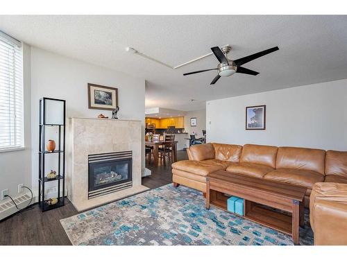 1508-1108 6 Avenue Sw, Calgary, AB - Indoor Photo Showing Living Room With Fireplace