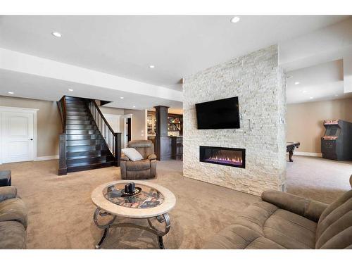 124 Grizzly Rise, Rural Rocky View County, AB - Indoor Photo Showing Living Room With Fireplace