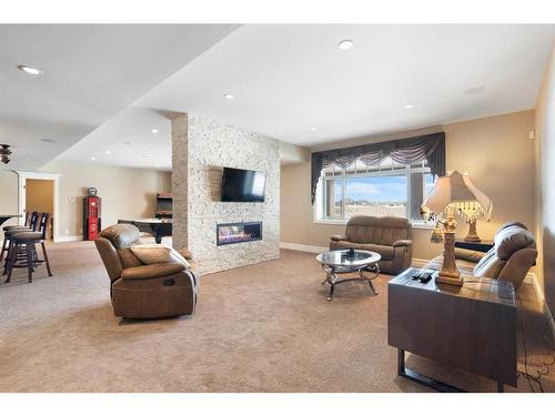 124 Grizzly Rise, Rural Rocky View County, AB - Indoor Photo Showing Living Room With Fireplace