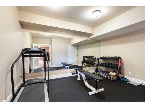 124 Grizzly Rise, Rural Rocky View County, AB - Indoor Photo Showing Gym Room