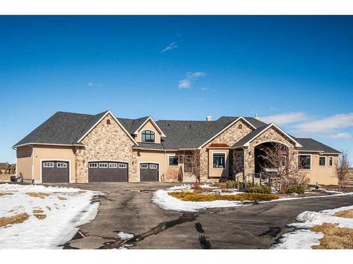 124 Grizzly Rise, Rural Rocky View County, AB - Outdoor With Facade