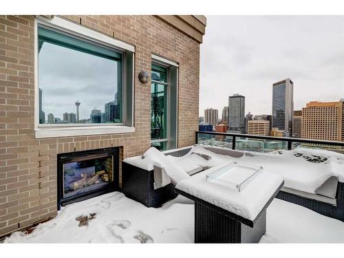 1804-788 12 Avenue Sw, Calgary, AB - Outdoor With Fireplace With Exterior