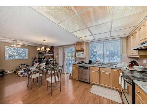 14 Varmoor Place Nw, Calgary, AB - Indoor Photo Showing Kitchen With Double Sink