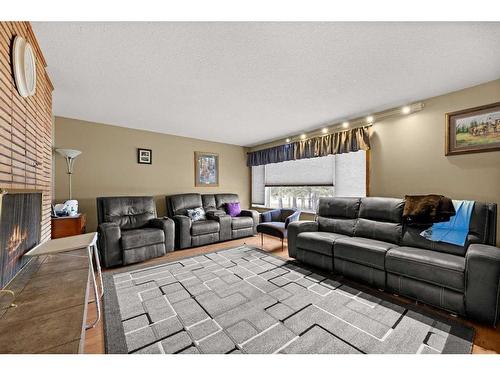 1064 Highway 587, Rural Red Deer County, AB - Indoor Photo Showing Living Room With Fireplace
