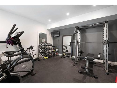 501 Hawk'S Nest Lane, Priddis Greens, AB - Indoor Photo Showing Gym Room