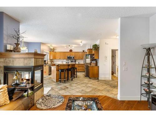 123 Chapala Crescent Se, Calgary, AB - Indoor Photo Showing Living Room With Fireplace