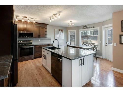 5 Bow Ridge Lane, Cochrane, AB - Indoor Photo Showing Kitchen With Double Sink